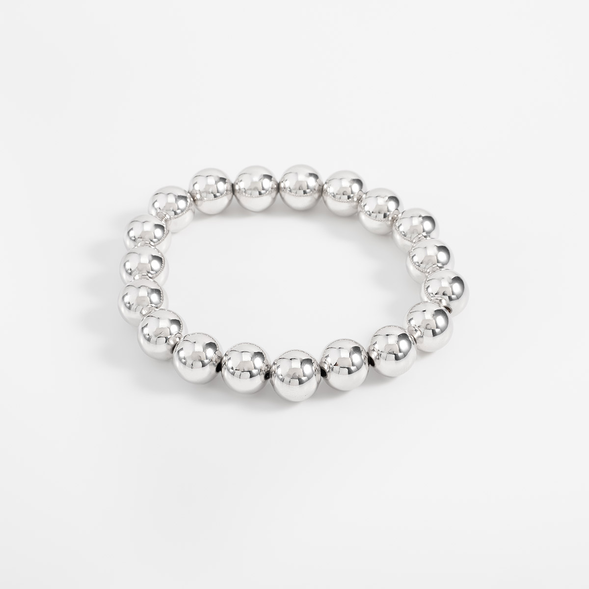 Pulsera en baño de rodio esferas lisas diseño minimalista