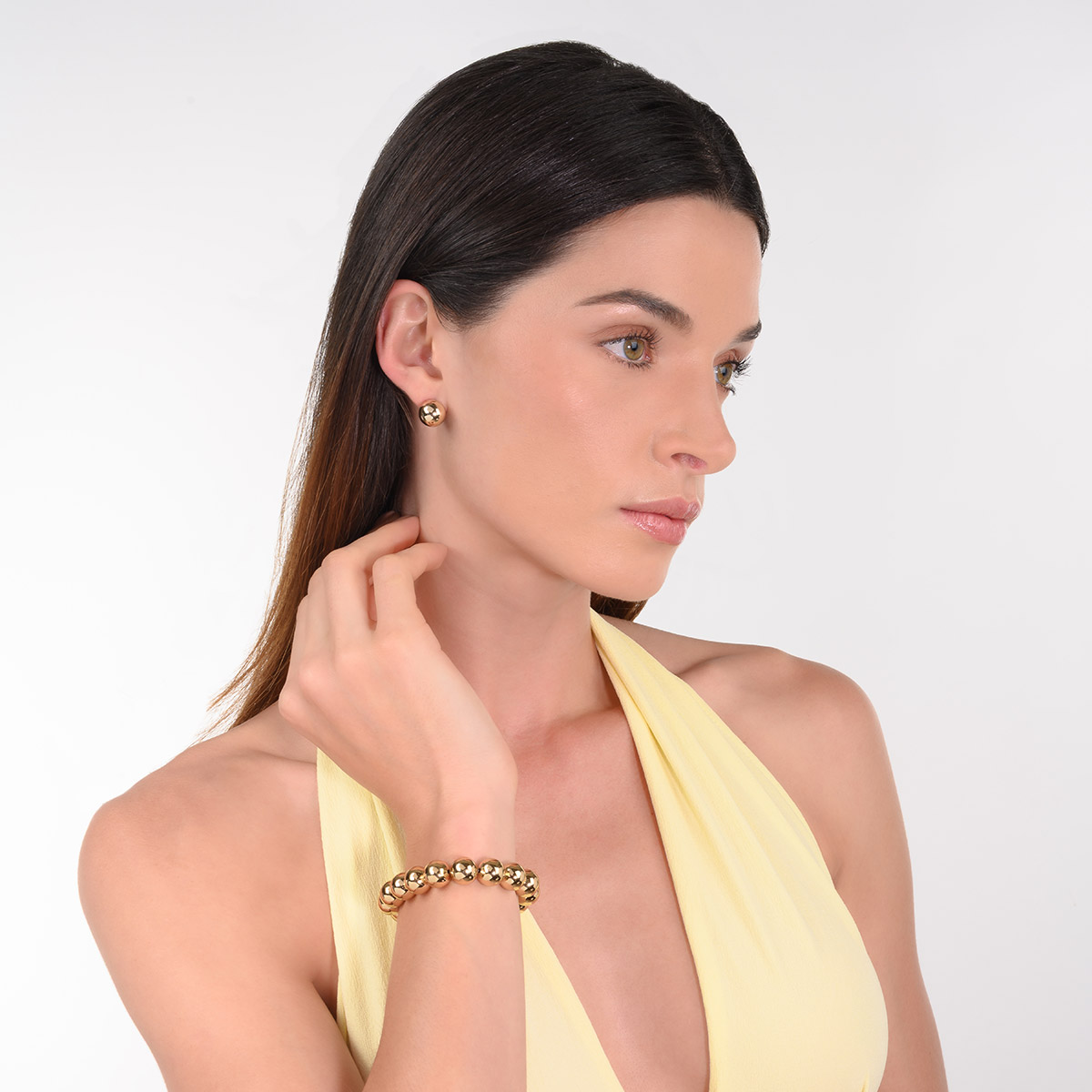 Pulsera en baño de oro esferas grandes diseño elástico
