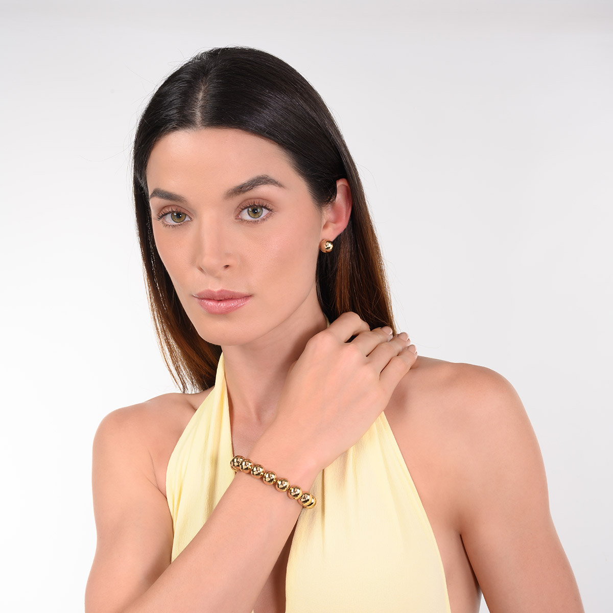 Pulsera en baño de oro esferas grandes diseño elástico