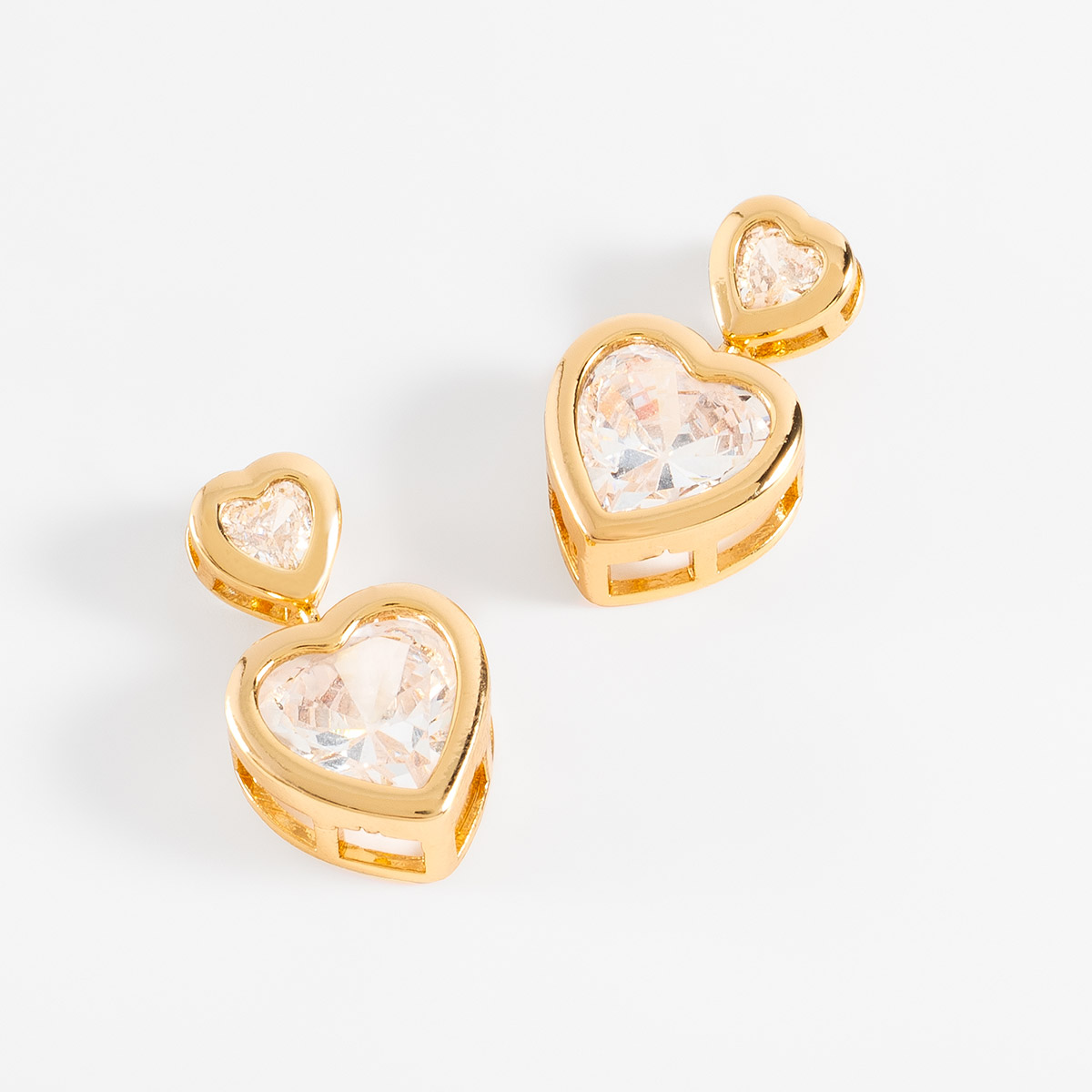 Aretes en baño de oro corazones dobles piedras brillante